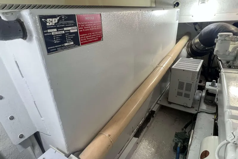  Yacht Photos Pics Engine room of a 2007 Henriques 42 Express boat, featuring equipment and labels.