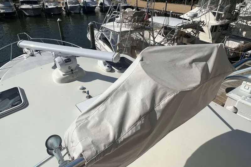  Yacht Photos Pics 2007 Henriques 42 Express yacht deck with radar and covered equipment.