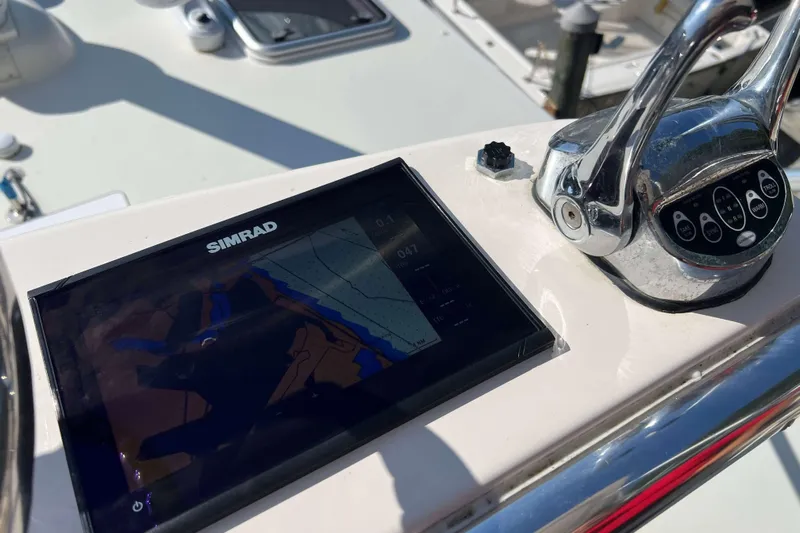  Yacht Photos Pics Control panel of 2007 Henriques 42 Express with Simrad navigation display.