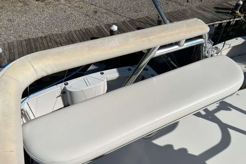  Yacht Photos Pics 2007 Henriques 42 Express boat seating area with white upholstery and metal frame.