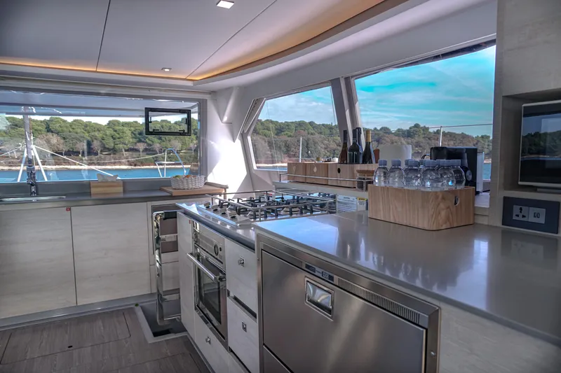 Solaia Yacht Photos Pics Luxurious kitchen interior on a 2020 Leopard 50 yacht, featuring modern appliances and scenic views.