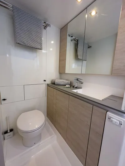 Solaia Yacht Photos Pics Modern bathroom in a 2020 Leopard 50 yacht, featuring sleek cabinetry and elegant fixtures.