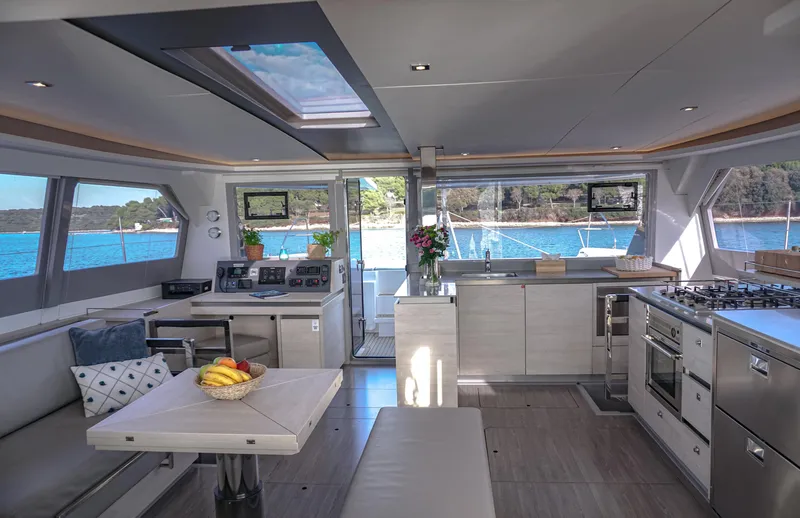 Solaia Yacht Photos Pics Luxurious interior of 2020 Leopard 50 yacht with modern kitchen and scenic ocean view.