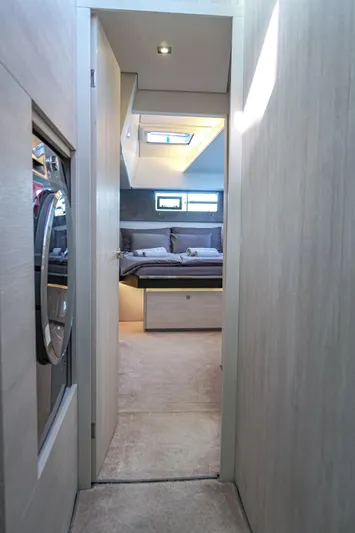 Solaia Yacht Photos Pics Luxurious interior of a 2020 Leopard 50 yacht, featuring a cozy bedroom.