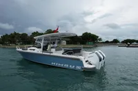 2023 Nimbus T9 X-Edition boat on water, featuring dual Mercury engines.
