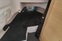 2023 Nimbus T9 X-Edition cabin interior with black bedding and storage pockets.