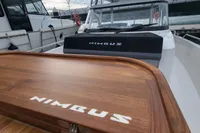 2023 Nimbus T9 X-Edition boat with wooden deck and sleek design.