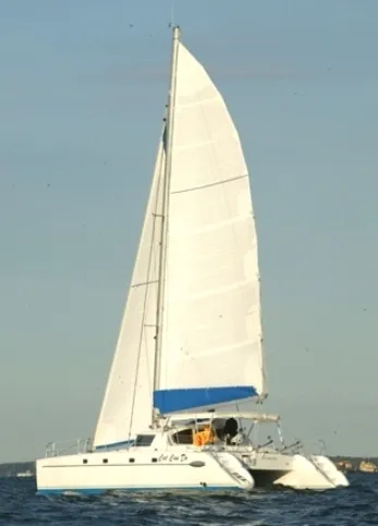 Ocean Mandalay Yacht Photos Pics Fountaine Pajot Belize 43 catamaran, 2003 model, sailing on open sea.