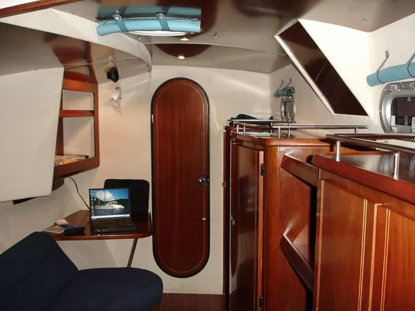 Ocean Mandalay Yacht Photos Pics Interior of a 2003 Fountaine Pajot Belize 43 yacht with wooden furnishings.