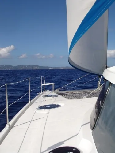 Ocean Mandalay Yacht Photos Pics Fountaine Pajot Belize 43 sailboat on open sea, year 2003.