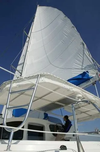 Ocean Mandalay Yacht Photos Pics Fountaine Pajot Belize 43 sailboat, 2003 model, with sail hoisted.