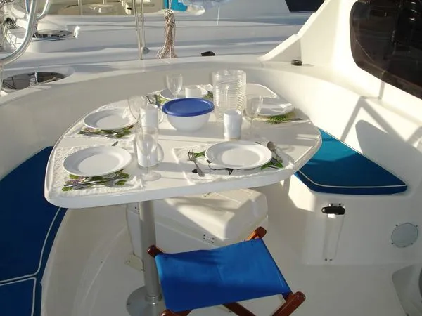 Ocean Mandalay Yacht Photos Pics Set table on 2003 Fountaine Pajot Belize 43 catamaran.