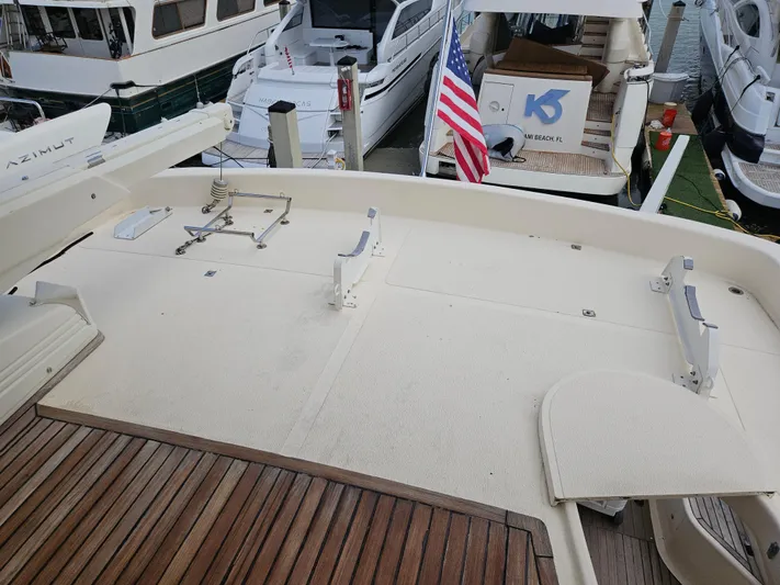  Yacht Photos Pics Astondoa 72 GLX Extended Platform 1998, docked with American flag, wooden deck.