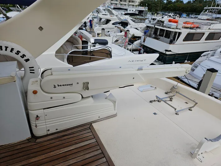  Yacht Photos Pics Astondoa 72 GLX yacht deck with extended platform, featuring a Besenzoni crane, 1998 model.