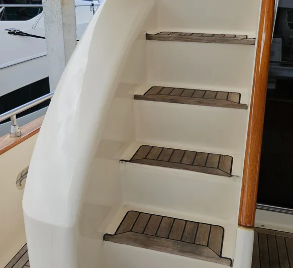  Yacht Photos Pics Staircase on 1998 Astondoa 72 GLX Extended Platform yacht with wooden steps.