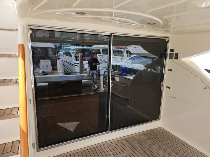  Yacht Photos Pics Astondoa 72 GLX yacht, 1998 model, featuring extended platform and sliding glass doors.