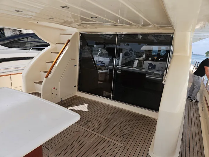  Yacht Photos Pics Astondoa 72 GLX yacht deck with stairs and sliding glass doors, 1998 model.