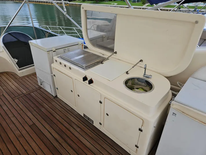  Yacht Photos Pics Outdoor kitchen on 1998 Astondoa 72 GLX yacht with sink and grill.