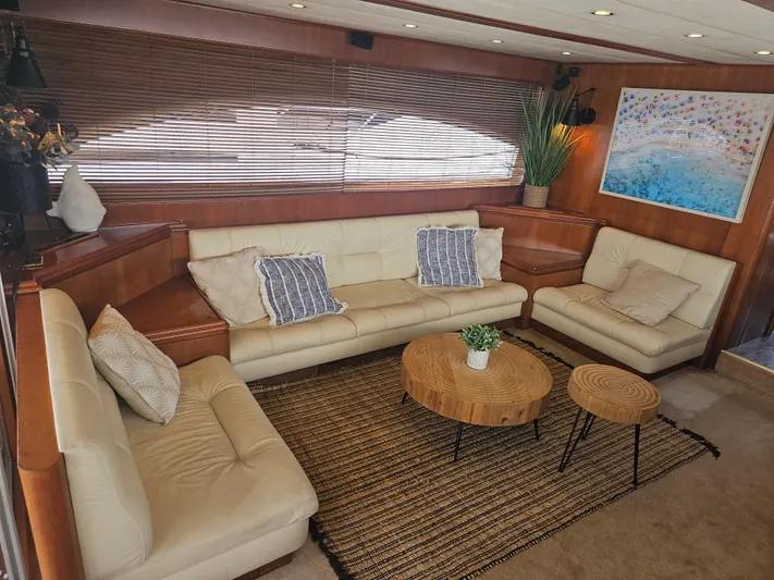 Yacht Photos Pics Luxurious interior of 1998 Astondoa 72 GLX yacht with cream leather sofas and wooden accents.