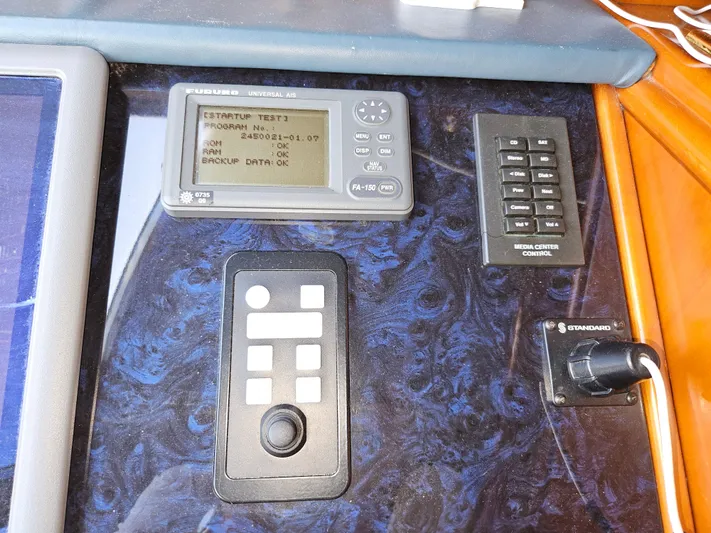  Yacht Photos Pics Control panel of 1998 Astondoa 72 GLX yacht with navigation and system controls.