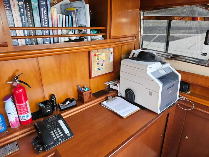  Yacht Photos Pics Office area on 1998 Astondoa 72 GLX yacht with printer, phone, and books.