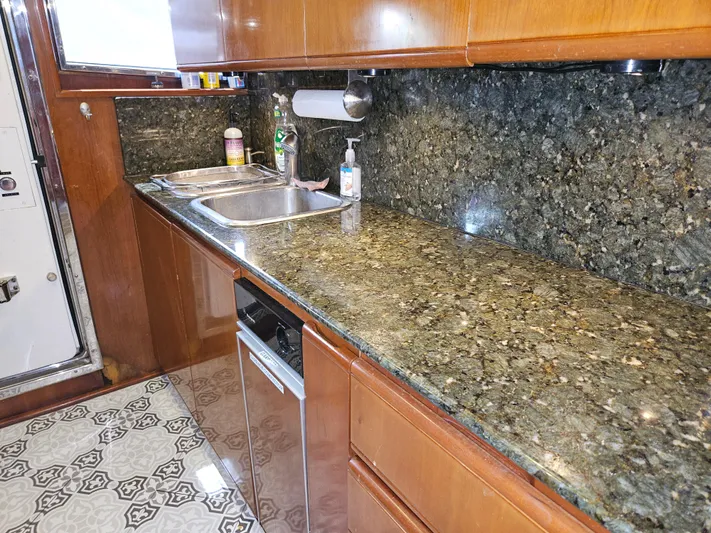  Yacht Photos Pics Luxurious kitchen interior of 1998 Astondoa 72 GLX yacht with granite countertops.