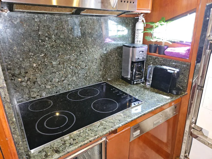  Yacht Photos Pics Astondoa 72 GLX 1998 yacht kitchen with granite countertops and modern appliances.