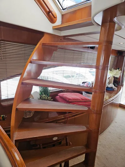  Yacht Photos Pics Wooden spiral staircase inside 1998 Astondoa 72 GLX yacht, elegant interior design.