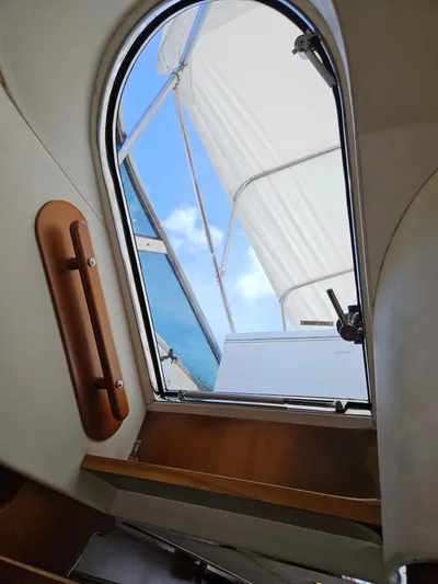  Yacht Photos Pics View from inside 1998 Astondoa 72 GLX yacht, looking out through hatch to blue sky.