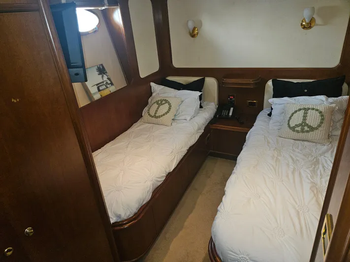  Yacht Photos Pics Twin cabin with peace-themed pillows on Astondoa 72 GLX yacht, 1998 model.