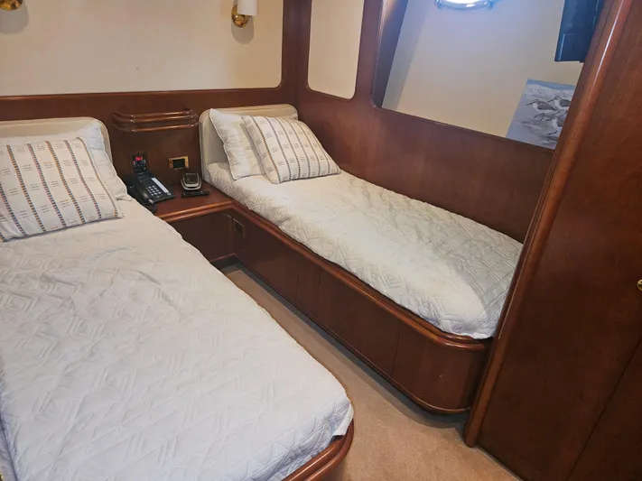  Yacht Photos Pics Twin cabin in 1998 Astondoa 72 GLX yacht with wooden interior and cozy bedding.