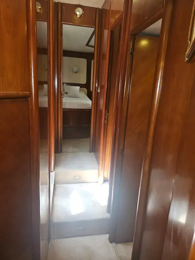  Yacht Photos Pics Interior hallway of 1998 Astondoa 72 GLX yacht with wooden finish.