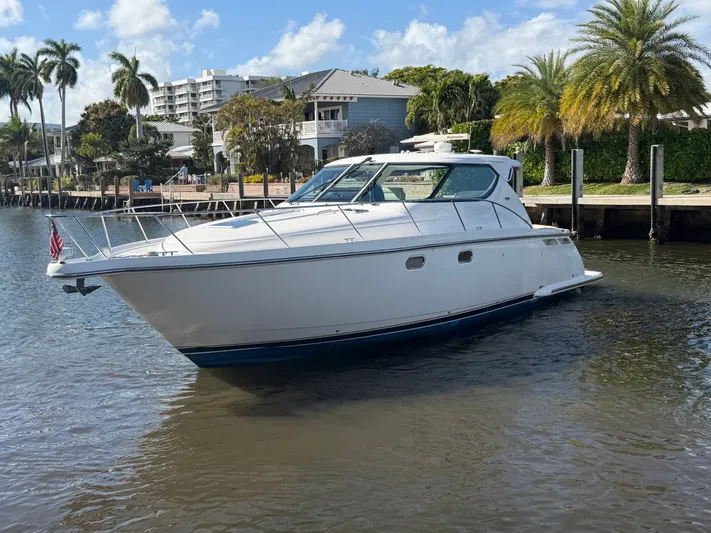  Yacht Photos Pics 2006 Tiara Yachts 4300 Sovran on calm water with palm trees.