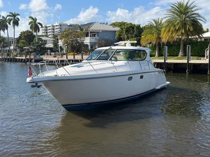 Yacht Photos Pics 2006 Tiara Yachts 4300 Sovran on calm water near dock.