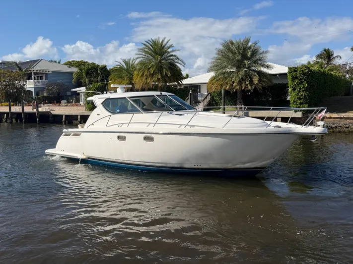  Yacht Photos Pics 2006 Tiara Yachts 4300 Sovran on calm water near dock.