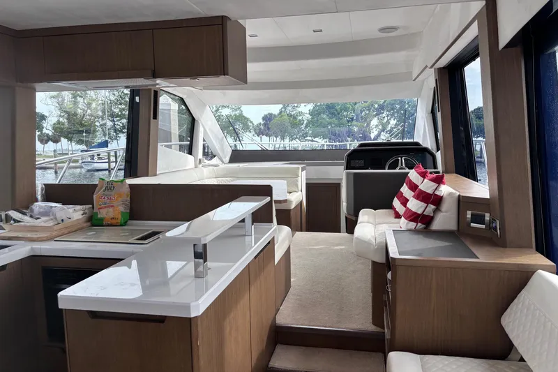  Yacht Photos Pics Interior of 2020 Galeon 500 Fly yacht with modern kitchen and seating area.