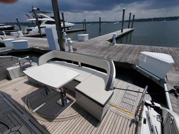  Yacht Photos Pics Galeon 500 Fly 2020 yacht at dock with seating and table on deck.