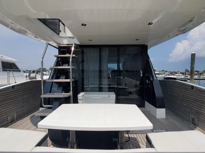  Yacht Photos Pics Galeon 500 Fly 2020 yacht with outdoor seating and staircase to upper deck.