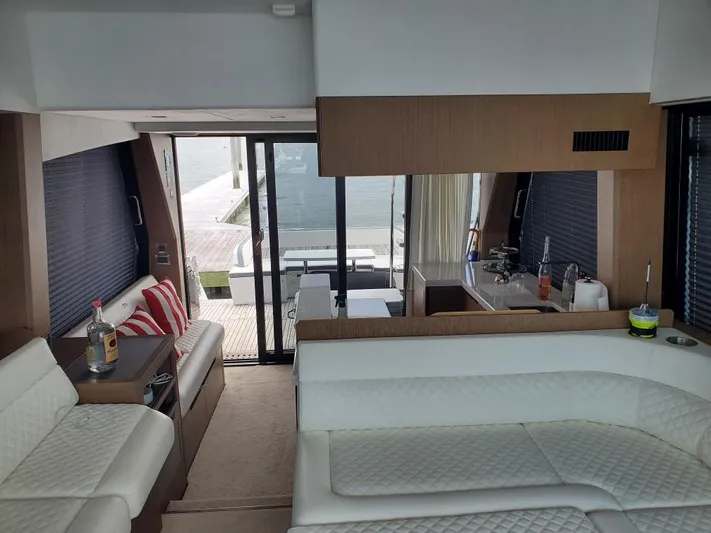  Yacht Photos Pics Interior of 2020 Galeon 500 Fly yacht with modern white seating and kitchenette.
