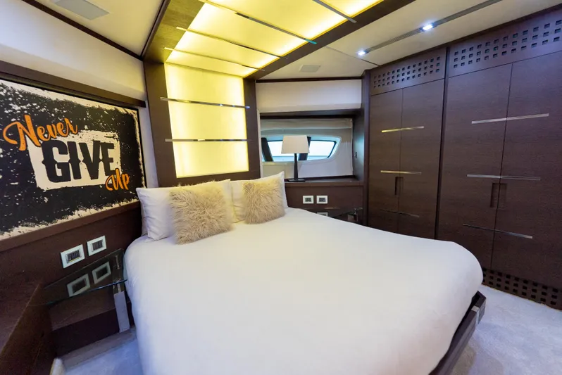  Yacht Photos Pics Luxurious bedroom interior on 2008 Azimut 103S yacht with modern decor and motivational artwork.