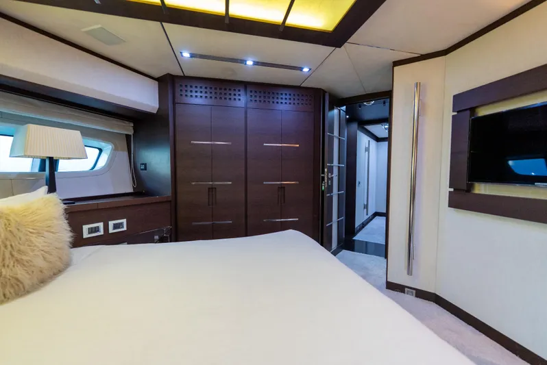  Yacht Photos Pics Luxurious bedroom interior of 2008 Azimut 103S yacht with modern design and elegant furnishings.