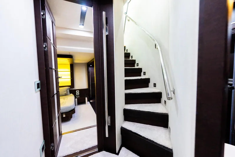  Yacht Photos Pics Luxurious interior of 2008 Azimut 103S yacht featuring elegant staircase and modern design.