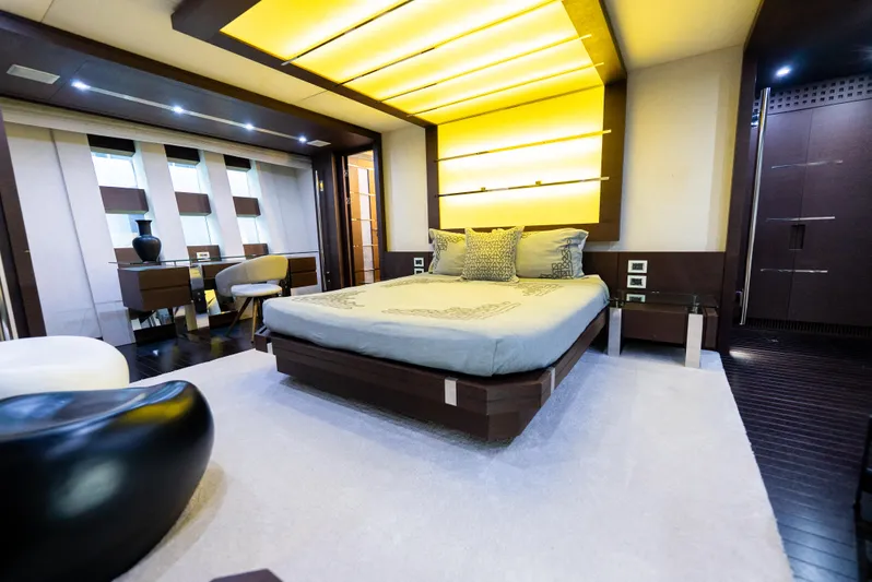  Yacht Photos Pics Luxurious bedroom interior on a 2008 Azimut 103S yacht, featuring modern design and ambient lighting.