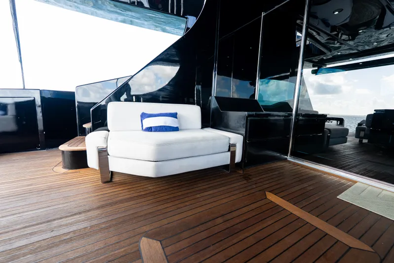  Yacht Photos Pics Luxurious deck of 2008 Azimut 103S yacht with white seating and wooden flooring.