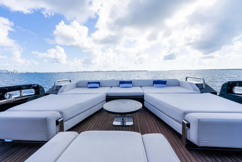  Yacht Photos Pics Luxurious Azimut 103S yacht deck with white seating, ocean view, and blue sky.