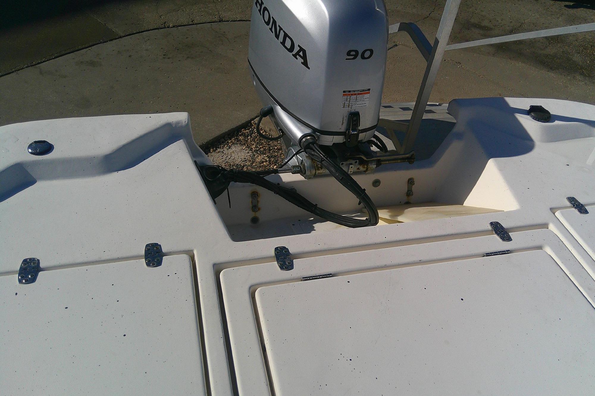 2017 Outcast 19V boat with Honda 90 outboard motor, rear deck view.