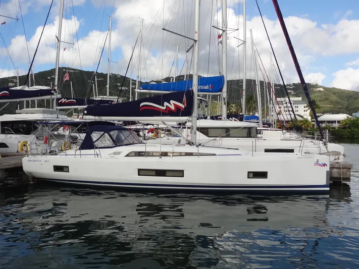 Exit Strategy Yacht Photos Pics 2020 Beneteau Oceanis 46.1 sailboat docked in a marina with other yachts.