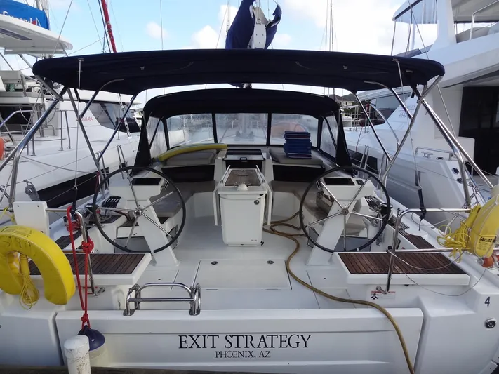 Exit Strategy Yacht Photos Pics 2020 Beneteau Oceanis 46.1 sailboat Exit Strategy docked at marina, rear view.