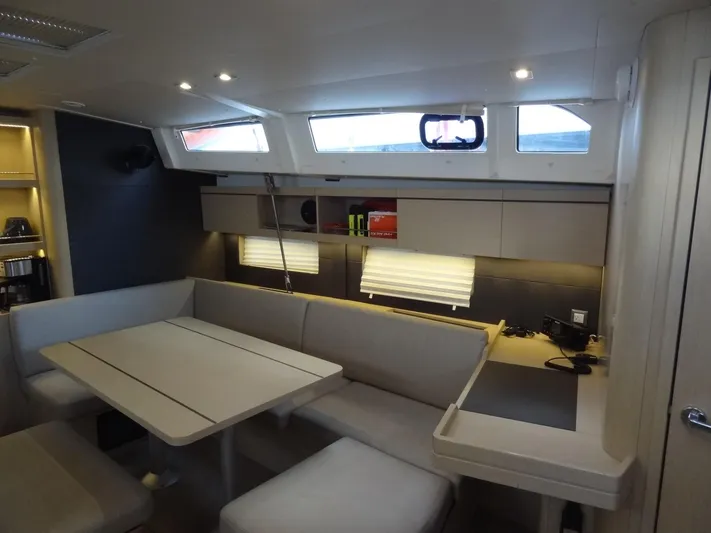 Exit Strategy Yacht Photos Pics Interior of 2020 Beneteau Oceanis 46.1 sailboat with modern seating and dining area.