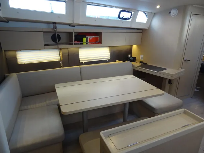 Exit Strategy Yacht Photos Pics Modern interior of 2020 Beneteau Oceanis 46.1 sailboat with dining area and seating.